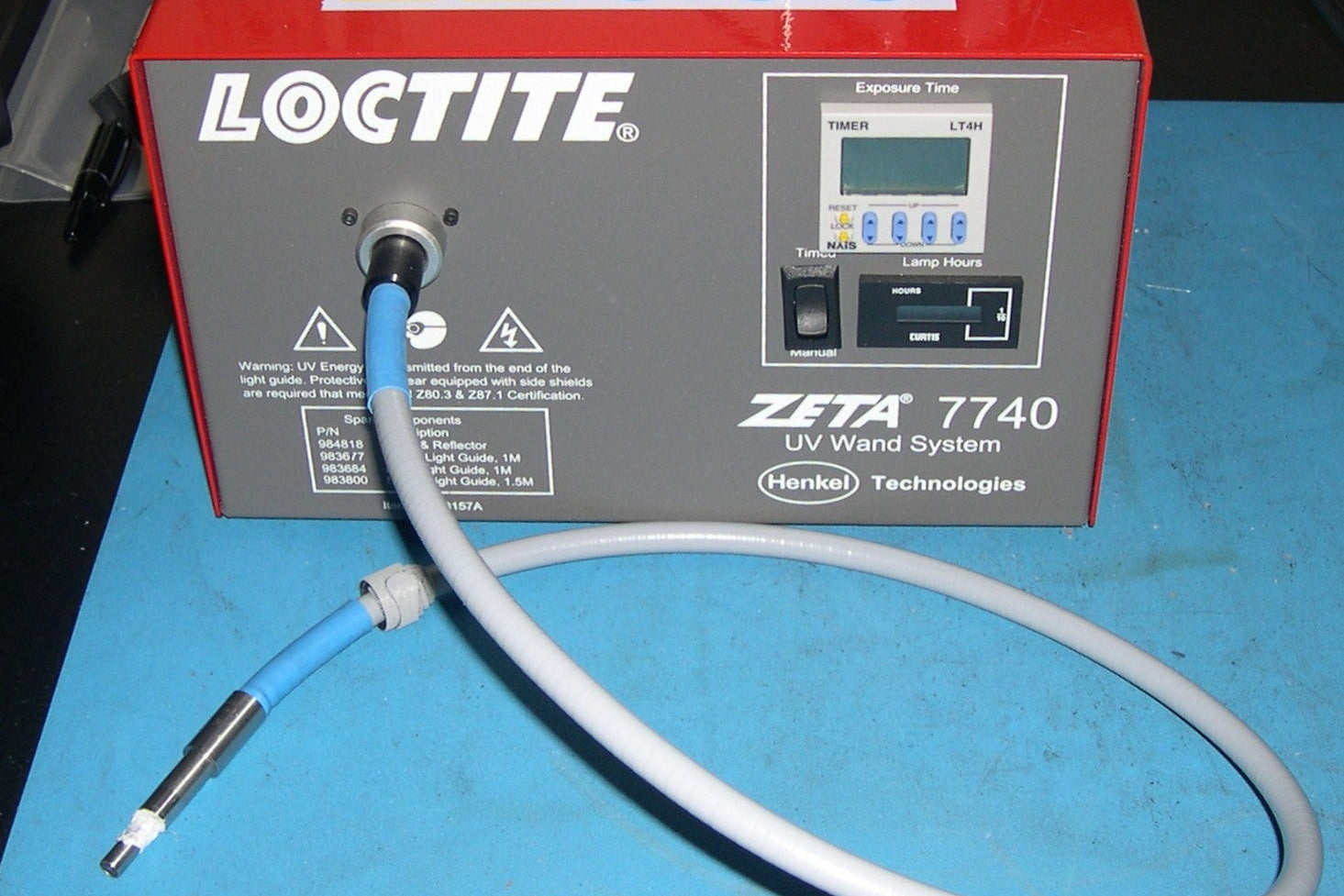 Loctite Zeta 7740 UV Wand System on a blue surface